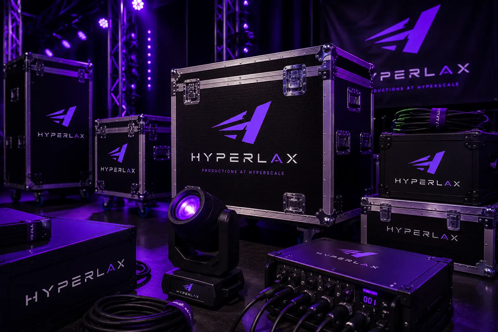 Hyperlax-branded flight cases, a moving-head light and a stagebox in a purple-lit warehouse
